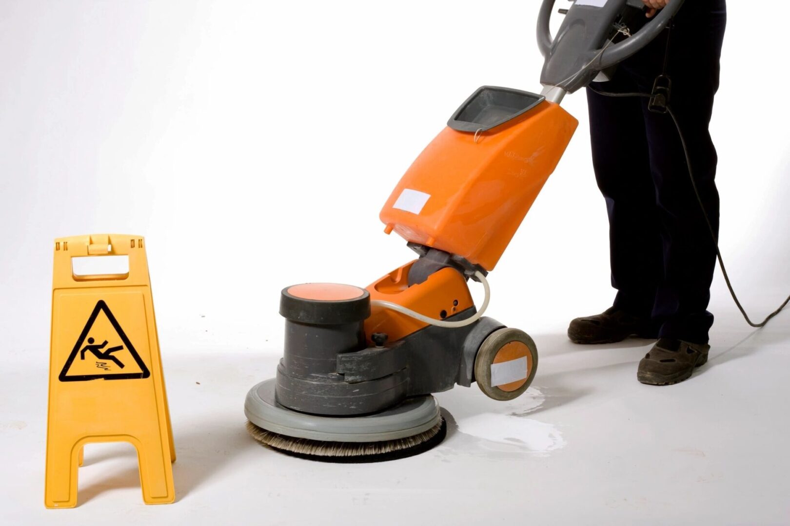 qtq80-7KKO0Z A man is using an orange machine to clean the floor.