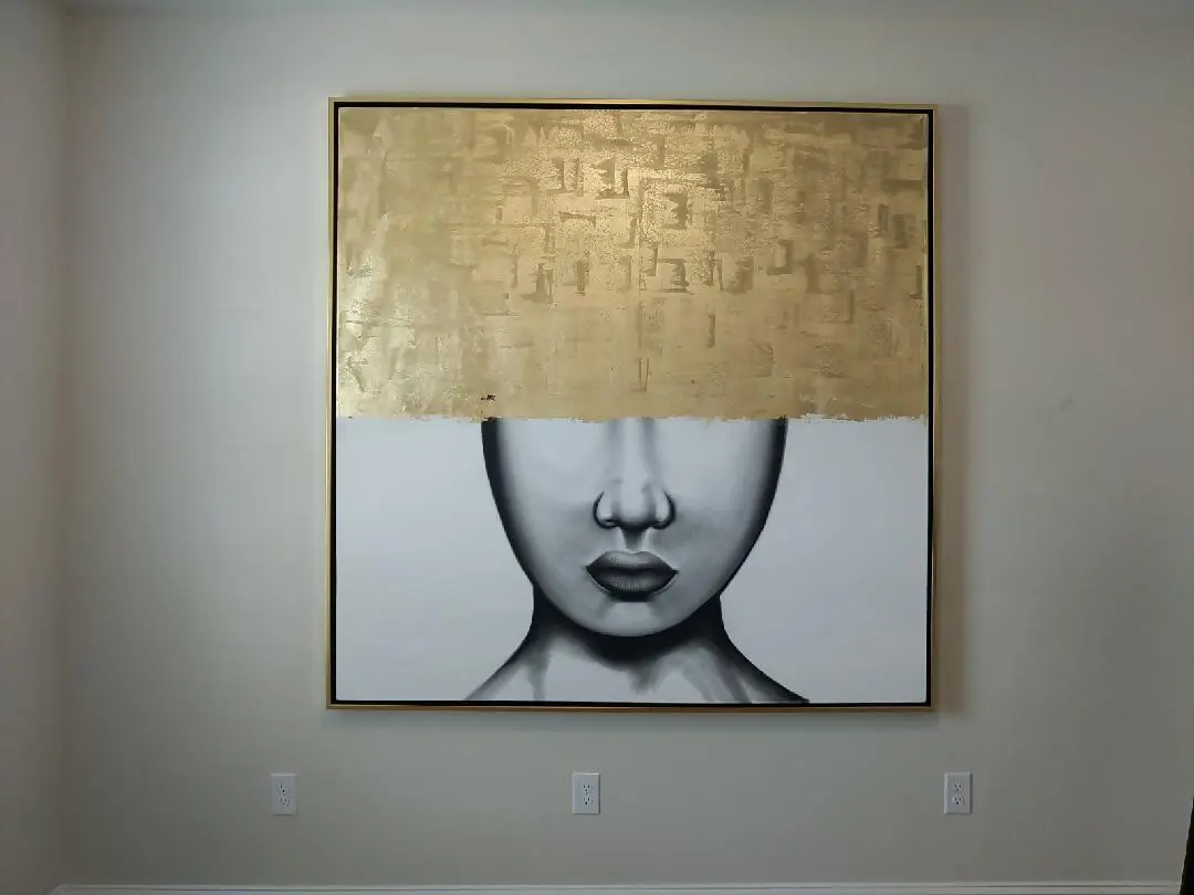 Artistic portrait with a gold foil crown covering the eyes.
